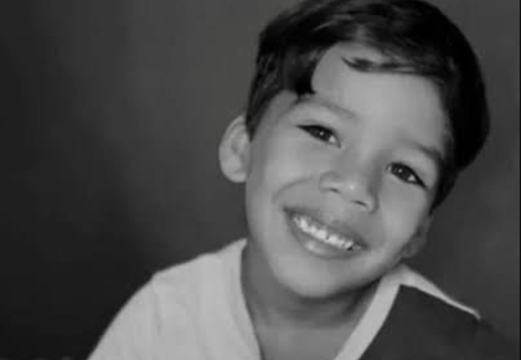 A five-year-old boy has died after being electrocuted by the metal frame of a beach stall in Brazil - his mum was shocked too as she tried to pull him free.