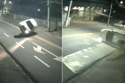 A driver flipped his car onto its roof, skidded upside down and knocked over a sign - then simply carried on driving as if nothing had happened in Brazil.