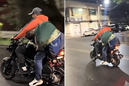 A drunk football fan was taped to the back of a motorbike by his mates after apparently becoming too sozzled to make it home following World Cup celebrations.