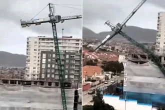 A giant crane was blown over by powerful winds and crashed onto a row of homes in Chile, damaging six houses - a 13-year-old girl inside had a lucky escape.