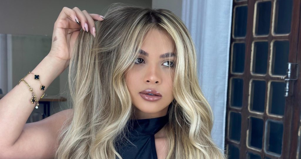 A glamorous influencer has been arrested over the killing of a retired police officer who was ambushed and shot dead near a supermarket in Brazil.