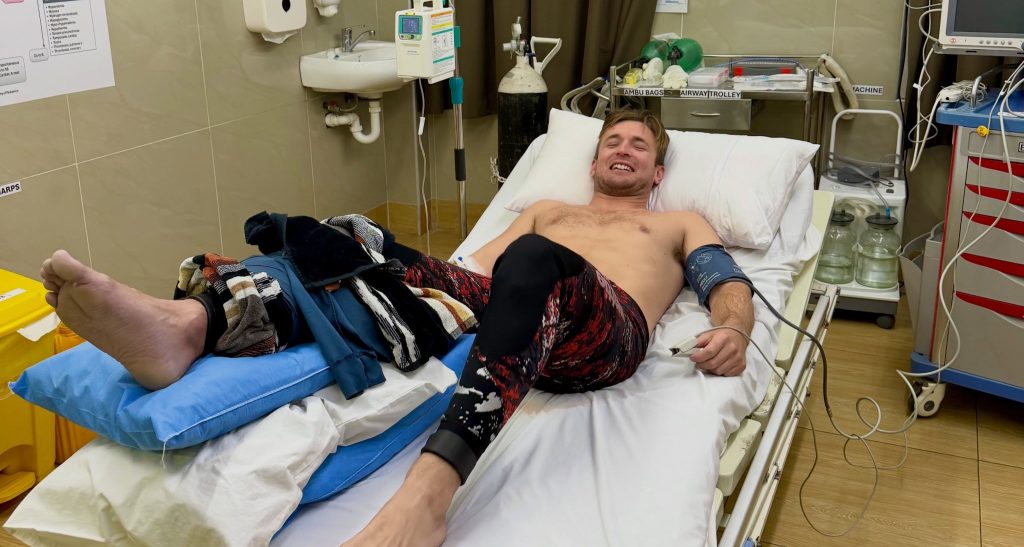 Fishing influencer left needing four surgeries and a skin graft after a grey reef shark attack in Fiji almost cost him his leg - but he has 'no hard feelings' towards the predator.