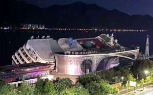 A £22m luxury cruise ship toppled over at its dock in China as Typhoon Bavi whipped up spring tides - the vessel had sat idle for 14 years.