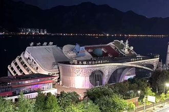 A £22m luxury cruise ship toppled over at its dock in China as Typhoon Bavi whipped up spring tides - the vessel had sat idle for 14 years.