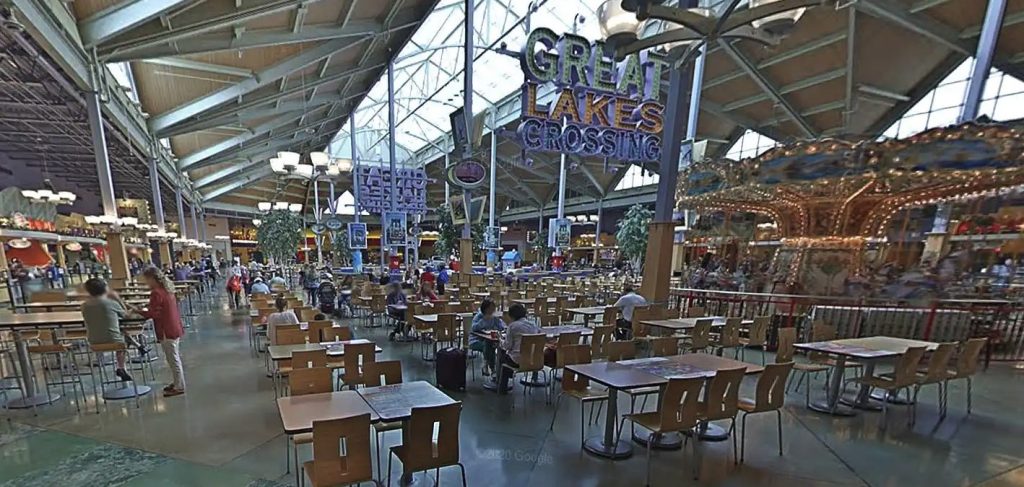 Man, 20, named as KeShawn Emery after being shot dead in a Michigan shopping centre food court, as terrified shoppers fled and a woman was also wounded in the chaos.