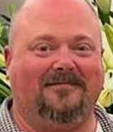 A man has been charged with murdering three apartment workers in Minnesota over a £48 parking fee dispute - allegedly firing 12 shots after being told he could not cancel it.