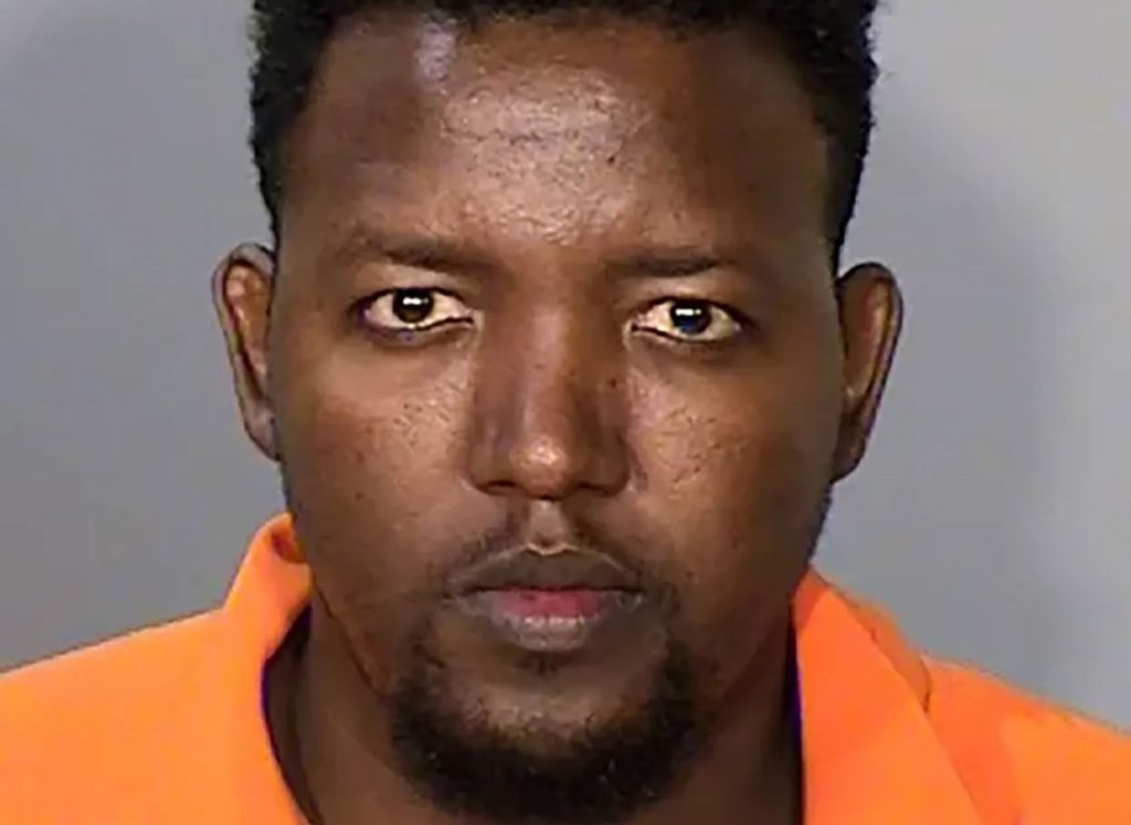 A man has been charged with murdering three apartment workers in Minnesota over a £48 parking fee dispute - allegedly firing 12 shots after being told he could not cancel it.