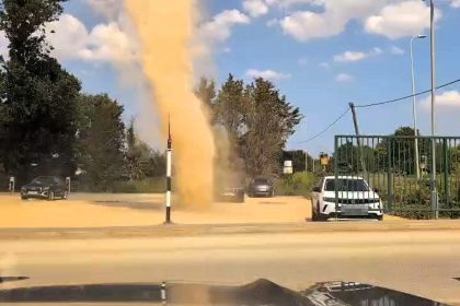 A "mini tornado" sends dust swirling high over a farm shop car park in Lincolnshire as Britain's scorching summer continues - staff say it's not something they see every day.