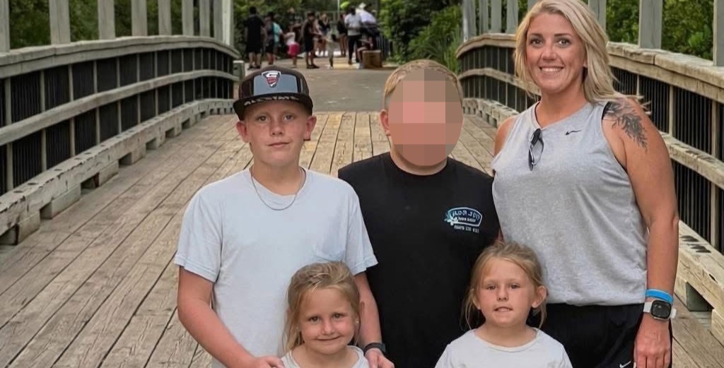 A driver accused of killing a mother and three of her children by running a red light has handed himself in almost three months on, after being indicted in Alabama.