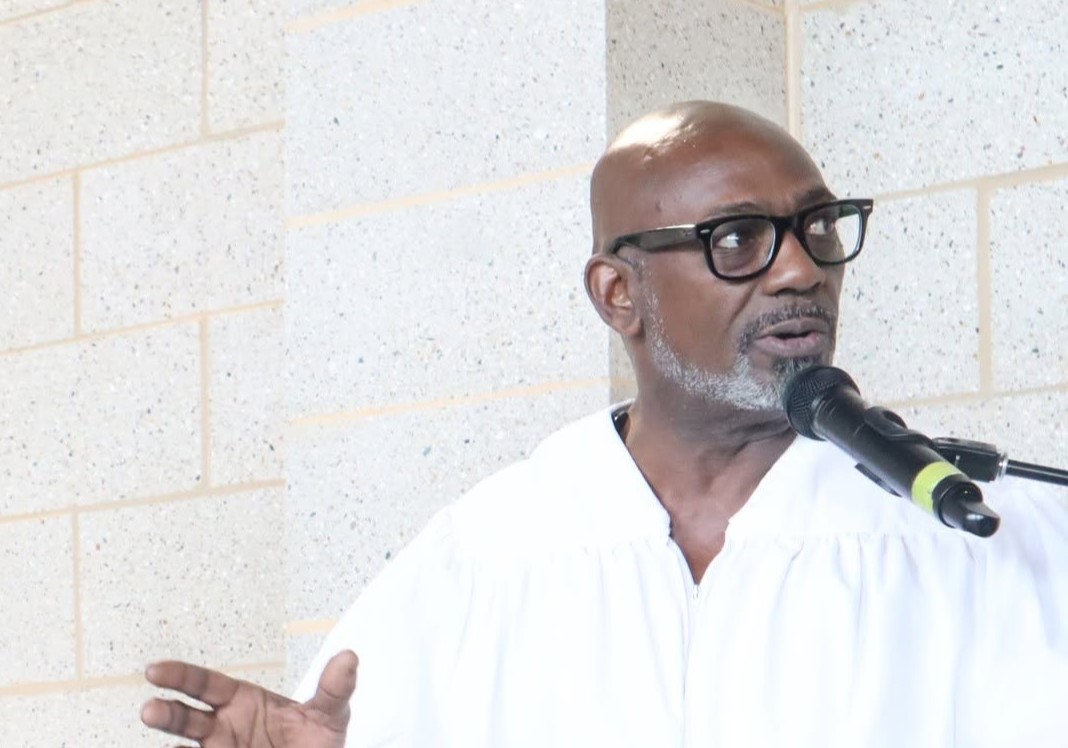 A US pastor is accused of stabbing his girlfriend's ex-boyfriend in a row over tools and a receipt before fleeing and hiding inside his church.