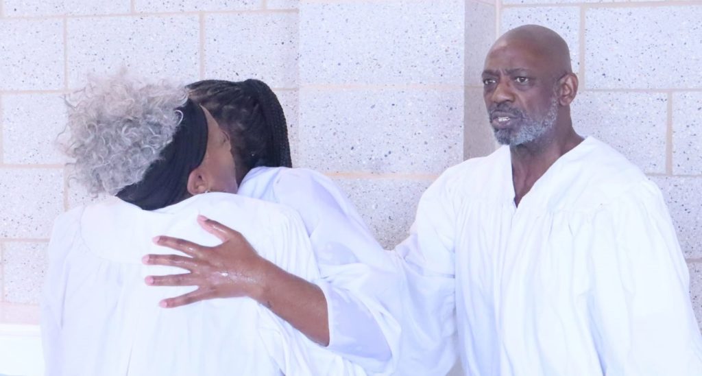 A US pastor is accused of stabbing his girlfriend's ex-boyfriend in a row over tools and a receipt before fleeing and hiding inside his church.