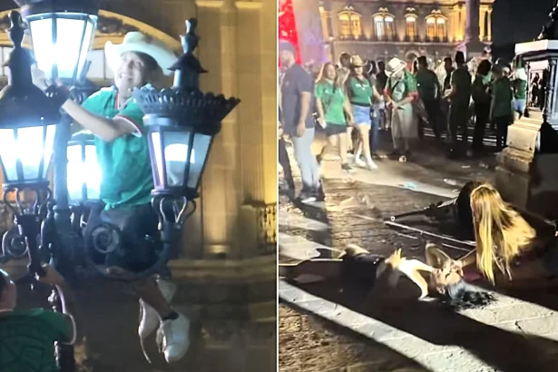 Wild footage shows Mexico fans crashing to the ground after climbing a historic lamppost during World Cup celebrations in Monterrey's Macroplaza.