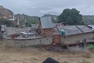 Dozens of shops were swept away after the Sukhnag river burst through a shopping complex in Kashmir - but advance warnings meant everyone escaped unharmed.