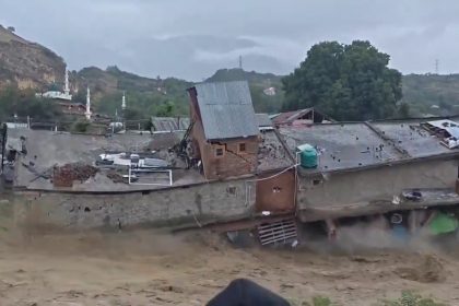Dozens of shops were swept away after the Sukhnag river burst through a shopping complex in Kashmir - but advance warnings meant everyone escaped unharmed.