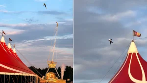 A stuntman was rushed to hospital after a hard landing when he was catapulted at 115mph over a circus big top in front of cheering crowds at a Dutch festival.