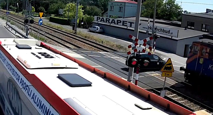 Two teens seriously injured after their car is struck by a freight train at a level crossing in Poland after ignoring flashing red warning signals.