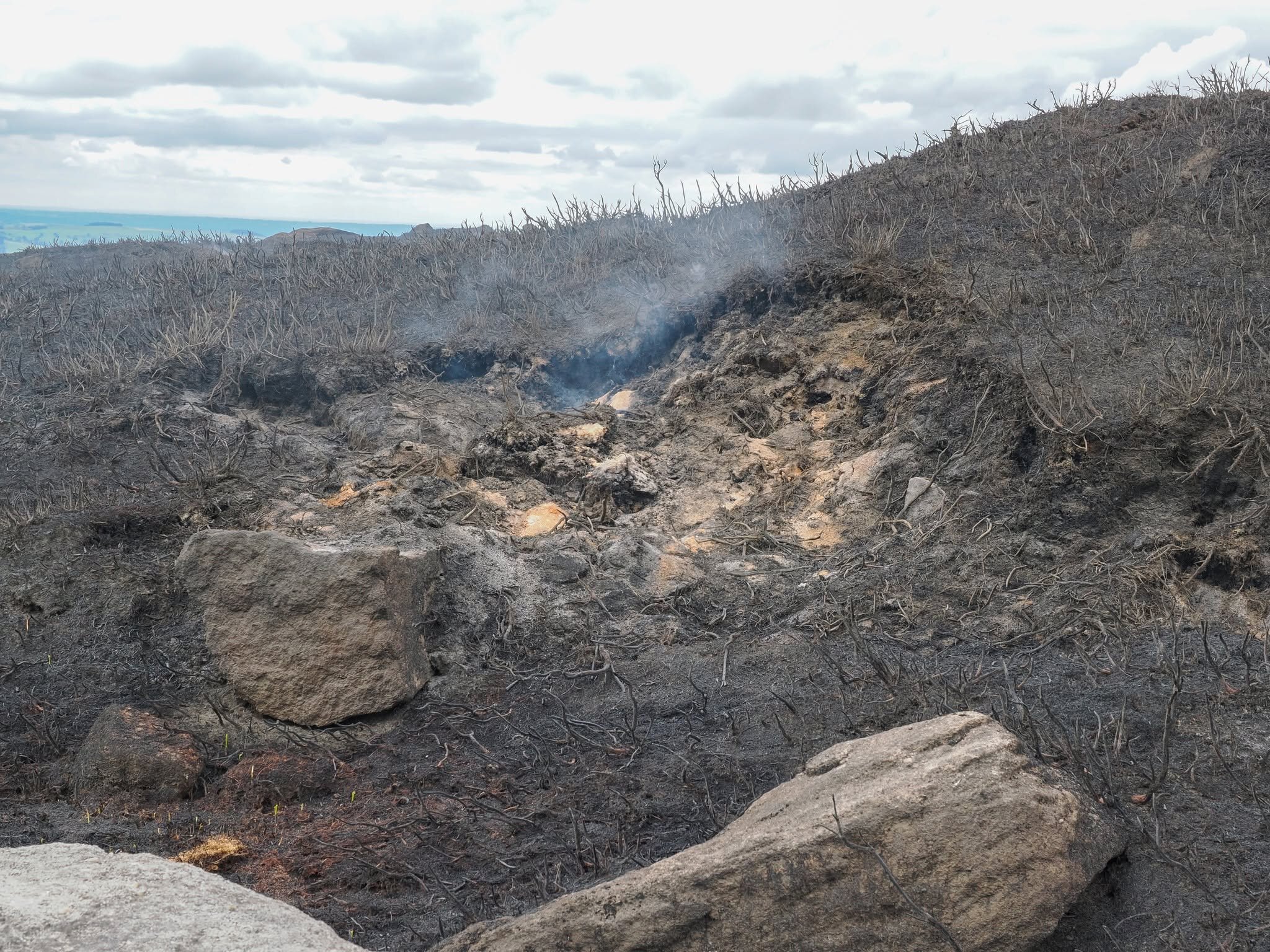 Crews battle day and night to stop a huge wildfire tearing across the tinder-dry Peak District - deep peat ignitions keep reigniting the blaze as it creeps towards homes near Carrbrook.