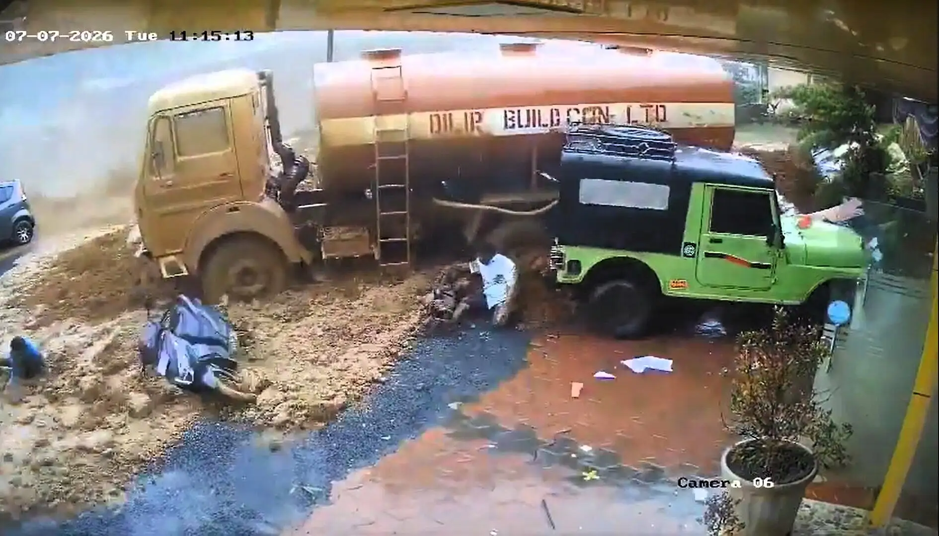 Two dead and dozens feared trapped as massive mudslide tears through construction site