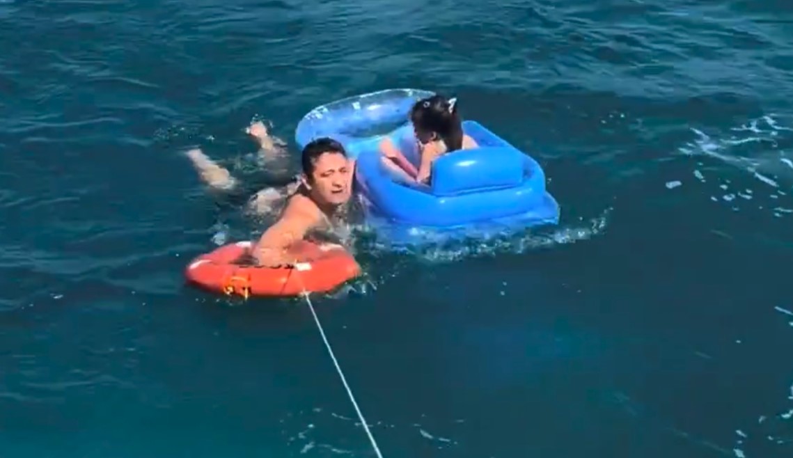 A young girl was swept far out to sea on an inflatable lounger as terrified beachgoers watched - coastguards reached her just in time and brought her ashore unharmed.
