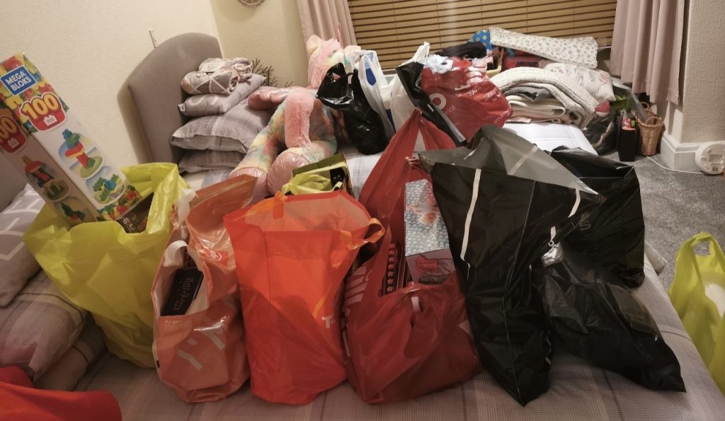 Shopaholic mum who blew £1,000 in a single day reveals how she clawed her way back from £23,000 of debt by budgeting, cash stuffing and juggling four jobs.
