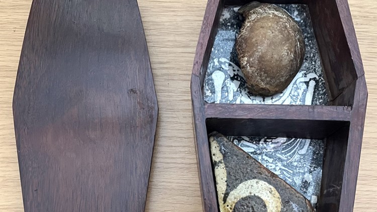 An abbot's kneecap pinched from an opened tomb by an 11-year-old boy on a 1956 school trip has been returned to Glastonbury Abbey over 70 years later.