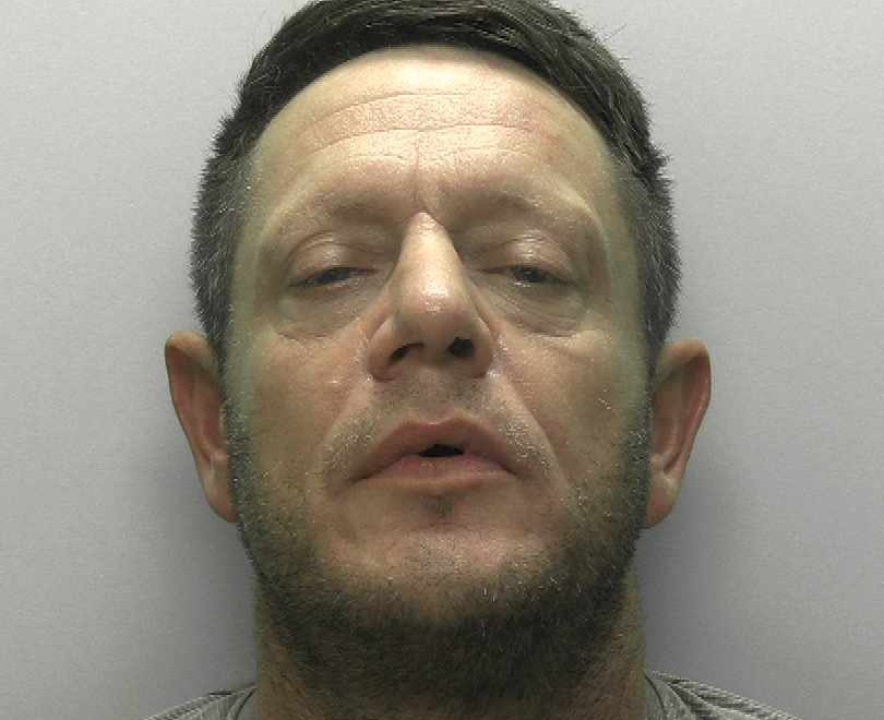 A man jailed for a balaclava-clad wrench attack on a father at his home is now on the run - and police are warning the public not to approach him.