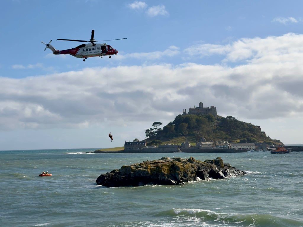 Five Bank Holiday tourists had to be winched to safety by helicopter after ignoring the incoming tide at Cornwall's Chapel Rock - branded "completely reckless" by a witness.