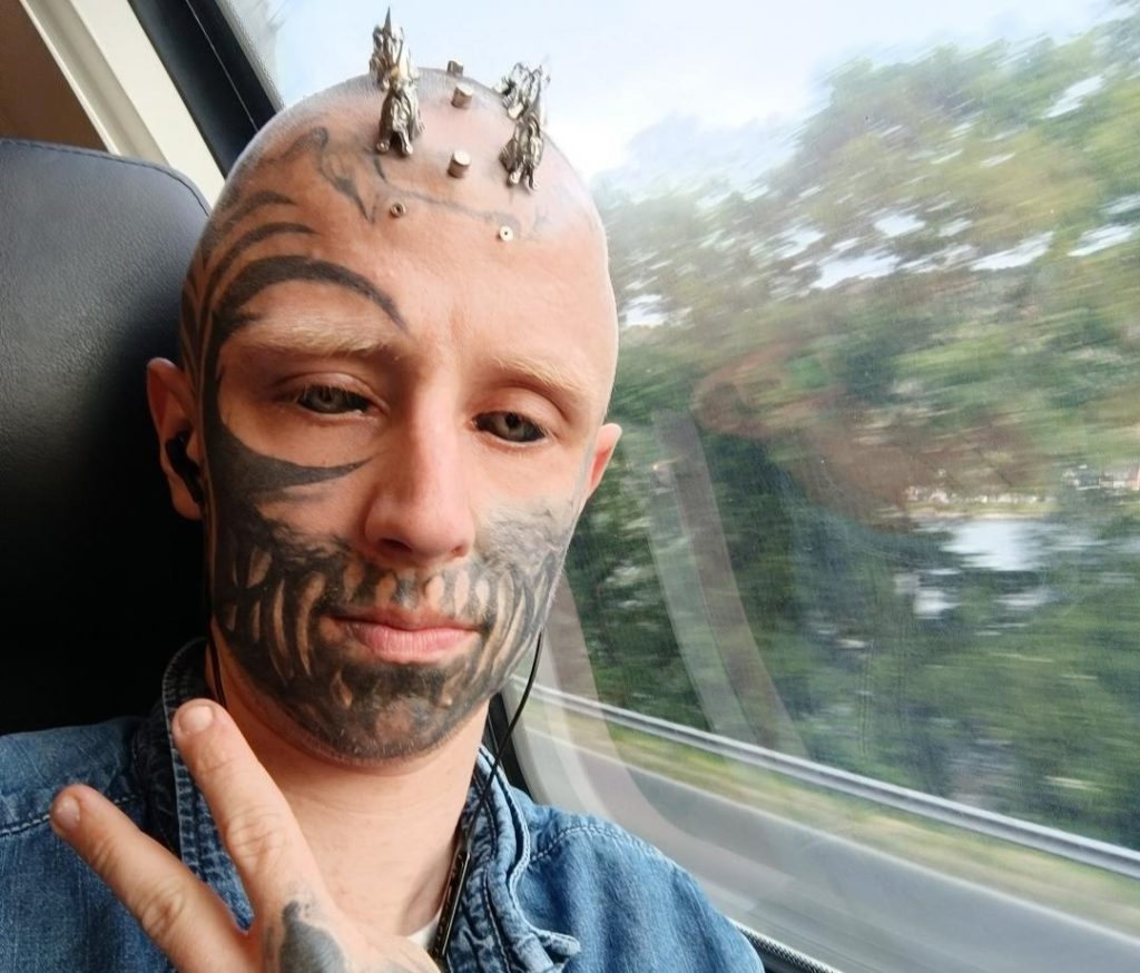 Blind man with tattooed black eyeballs is constantly accused of blinding himself - but a rare genetic condition stole his sight years before the extreme body modification.