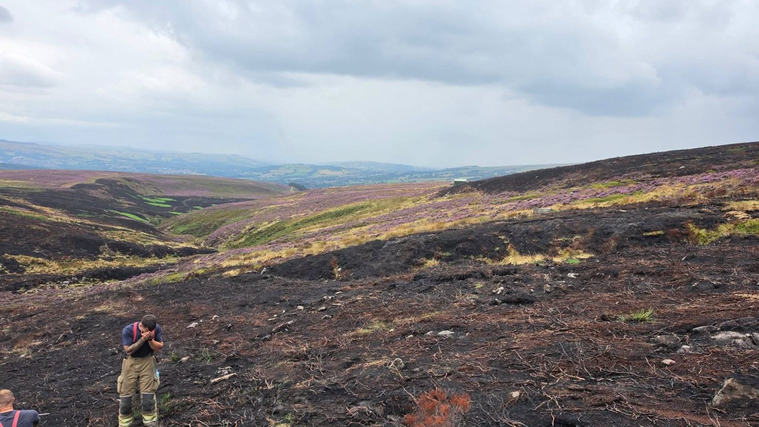 One of Britain's longest-running wildfires is finally out after burning almost 1,500 acres of moorland for two months - and the cause may never be known.