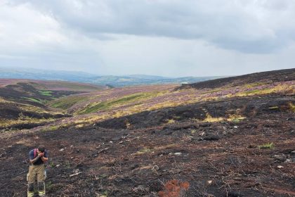 One of Britain's longest-running wildfires is finally out after burning almost 1,500 acres of moorland for two months - and the cause may never be known.