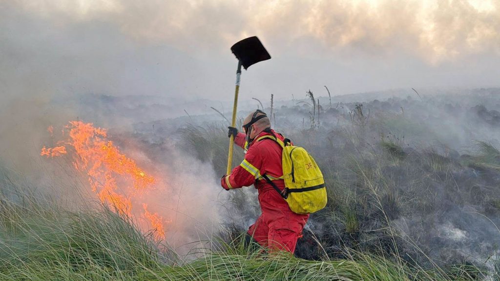 One of Britain's longest-running wildfires is finally out after burning almost 1,500 acres of moorland for two months - and the cause may never be known.