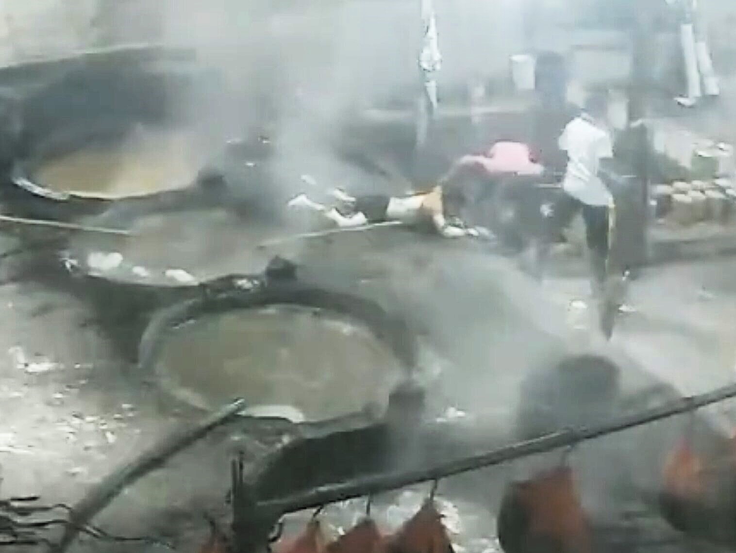 A worker died after falling into a vat of boiling sugar at a factory - CCTV shows him becoming dizzy and losing his balance moments before the fall.