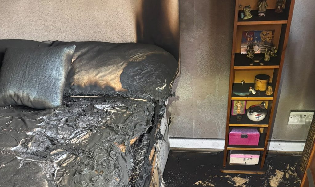 A British couple came home from holiday to find their house gutted by a fire sparked by a charging vacuum - but one simple habit stopped it spreading.