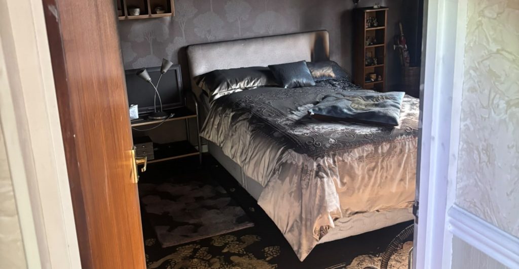 A British couple came home from holiday to find their house gutted by a fire sparked by a charging vacuum - but one simple habit stopped it spreading.