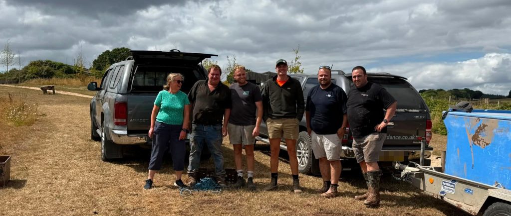 Residents and a local business have rescued an estimated 1,000 fish from a rapidly drying Exeter pond after no action was allegedly taken by officials.
