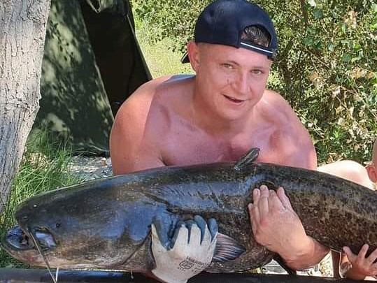 A British dad died after suffering a ruptured aneurysm on a fishing trip to France with his eight-year-old son, leaving his family desperate to bring him home.