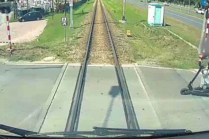 An e-scooter rider, 16, was seriously injured after ignoring flashing red lights at a level crossing and ploughing straight into the side of a speeding train.