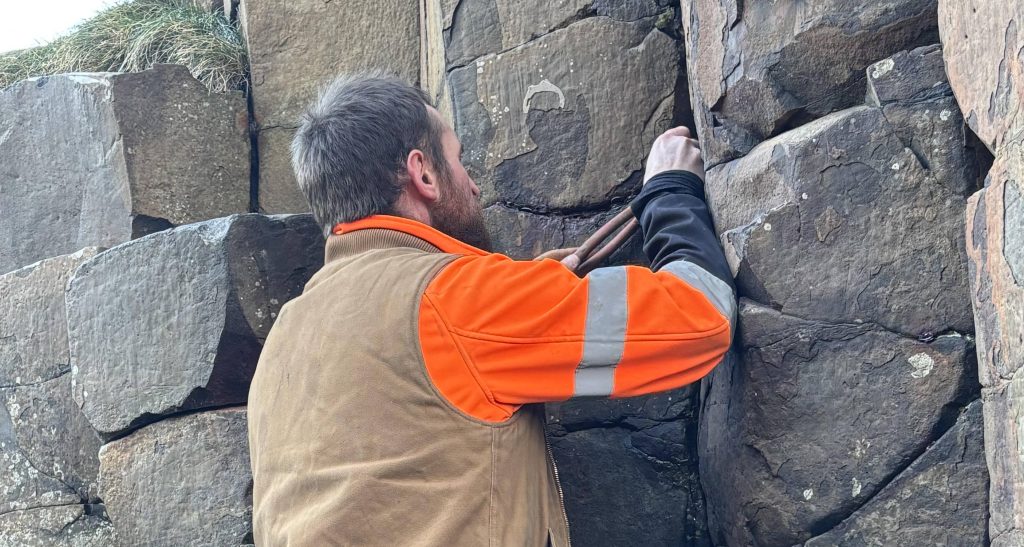 Tourists who hammered 10,000 coins into a World Heritage landmark left conservationists facing a painstaking 200-hour clean-up - with thousands still stuck.