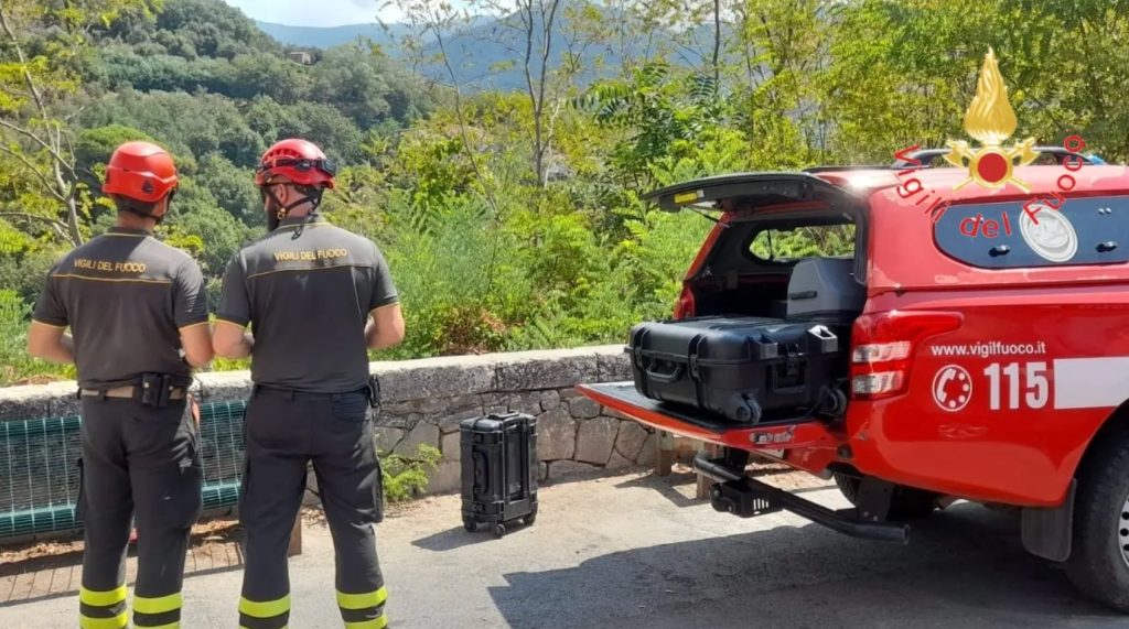 Two lawyers who went missing after their ultralight aircraft vanished shortly after take-off have been found dead - embracing inside the burned-out cockpit in remote Italian woodland.