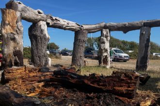 A Stonehenge copycat known as 'Woodhenge' has been engulfed by flames and destroyed as the UK battles 'scorched Earth' conditions, standing over a decade.