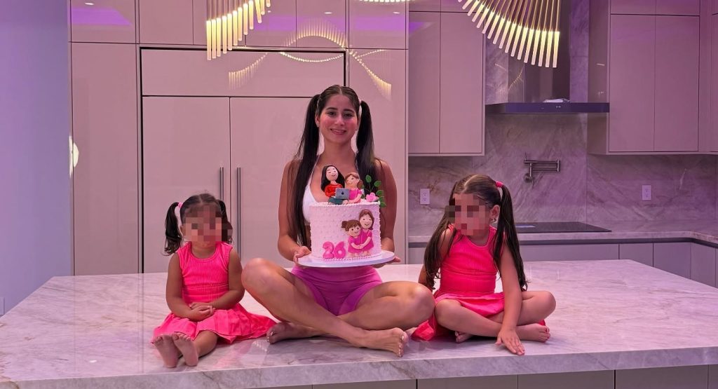 A mum has been arrested after videos allegedly showed her pouring melted candle wax onto her young daughters and setting fire to clothing inside their home.