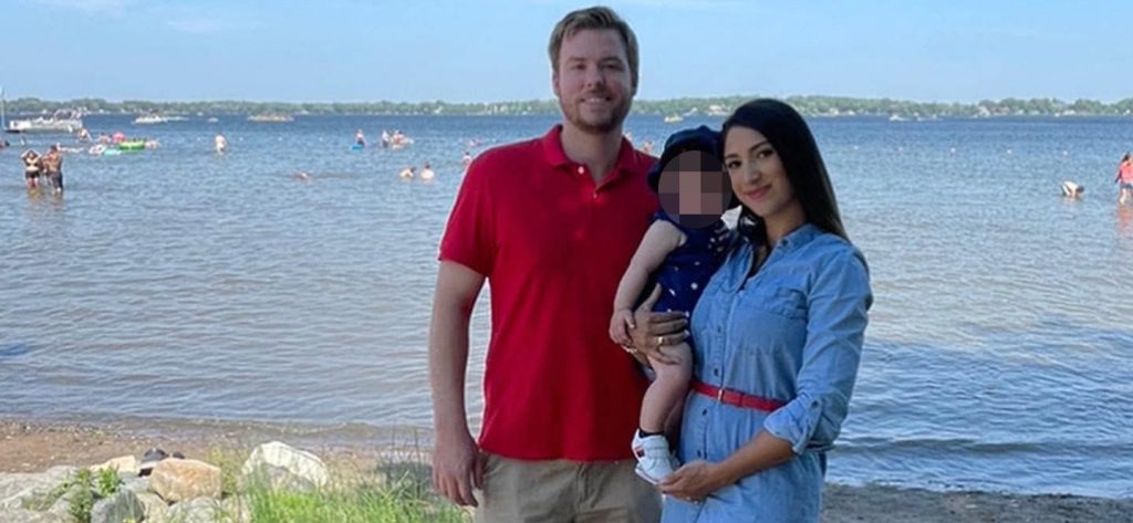A mum-of-two has been found dead in a car boot after her estranged husband allegedly answered the door to police with blood on his shirt.