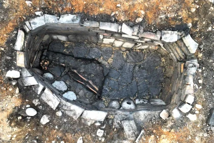 Archaeologists have unearthed a mysterious 2,000-year-old Iron Age pit holding a woman's skeleton - with one expert joking it could have been an ancient hot tub.