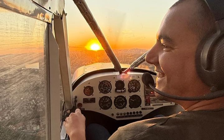 A pilot cheated death after his plane caught fire and crashed into a field - escaping the wreckage moments before it was engulfed in flames on his birthday.