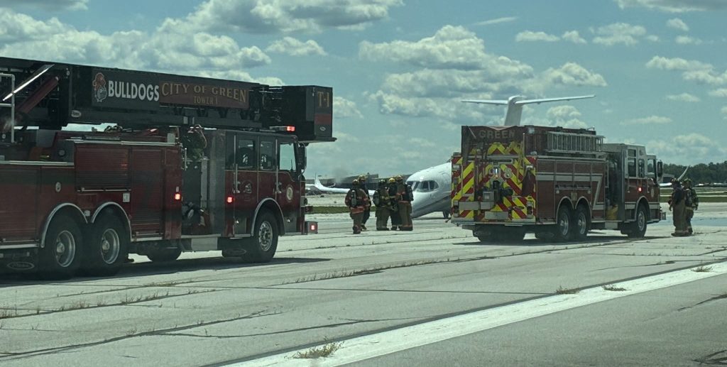 A plane was forced into a dramatic emergency landing after its nose gear failed to deploy - with fire crews lining the runway ready for the worst.