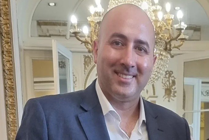 A presidential adviser has been arrested over an alleged plot to kill his pregnant ex-partner after she was shot three times outside a hotel by fake delivery riders.