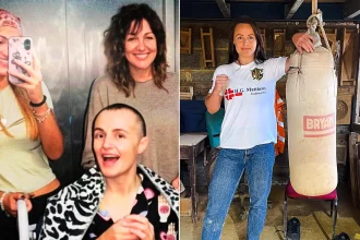 A champion boxer has flown home to the UK after suffering a bleed on the brain during sparring - with fans raising more than £97,000 to bring her back.