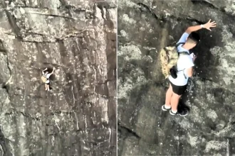 Climber branded 'stupid' after being filmed on his phone while stranded 260ft up a mountain on a ledge just 20 inches wide.