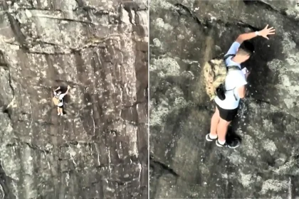 Climber branded 'stupid' after being filmed on his phone while stranded 260ft up a mountain on a ledge just 20 inches wide.