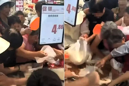 Shoppers have been filmed scrambling for discounted rice in chaotic scenes - with some grabbing handfuls with bare hands and one clambering on top of the pile.